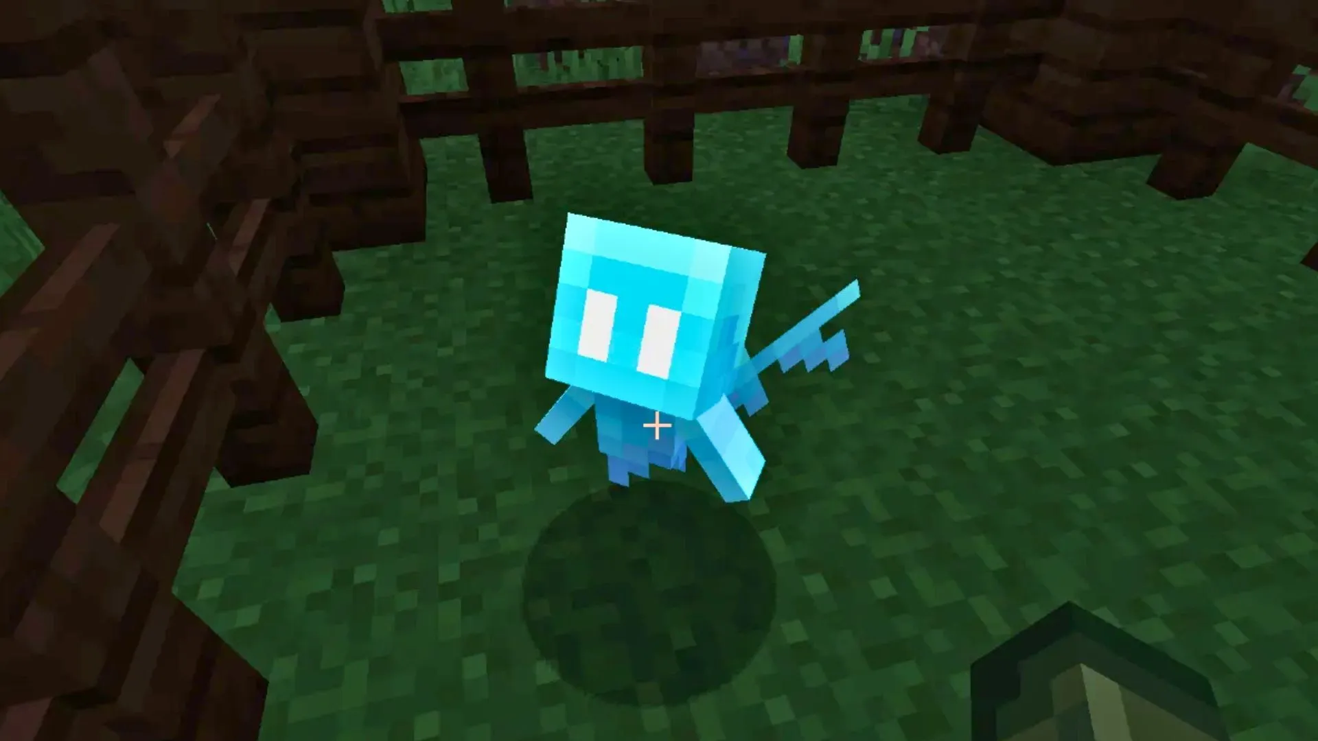 The small blue Allay mob - the 2021 Mob Vote winner - floating in a wooden fenced pen in Minecraft
